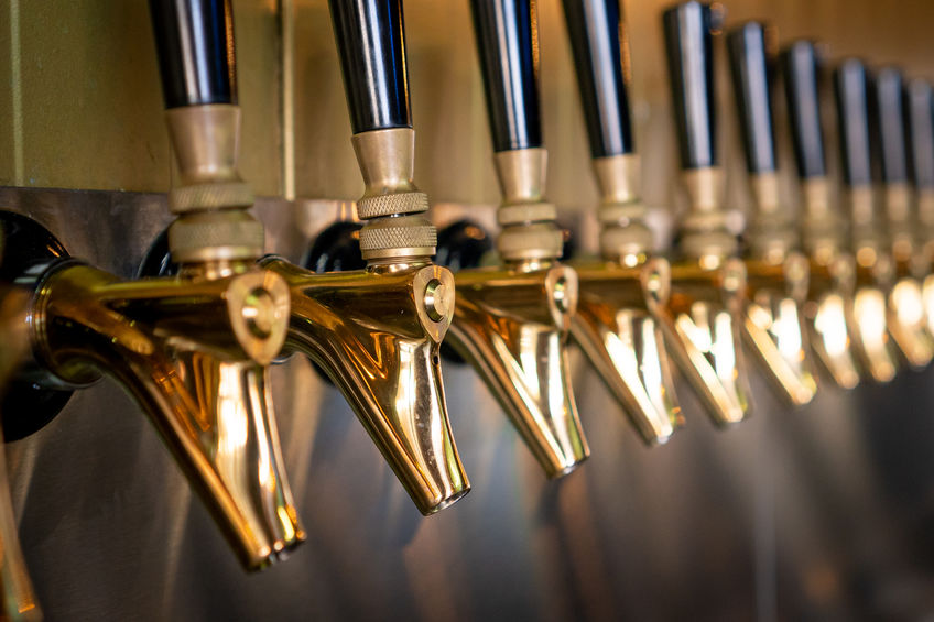 Innovative gold-colored beer taps with black handle
